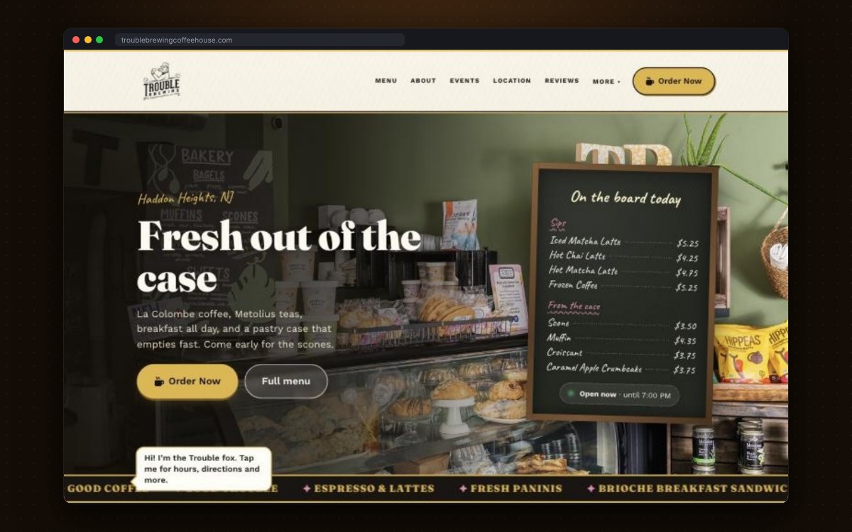 Trouble Brewing Coffee House homepage with an illustrated gallery wall